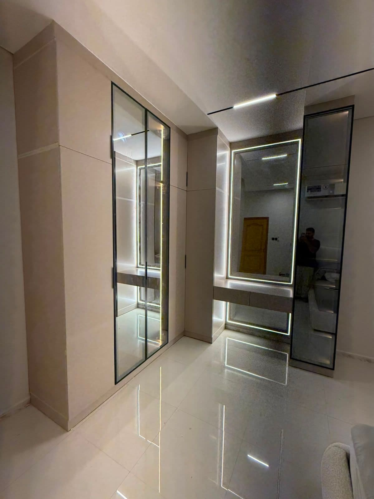 Mirrored wardrobe doors with integrated LED lighting