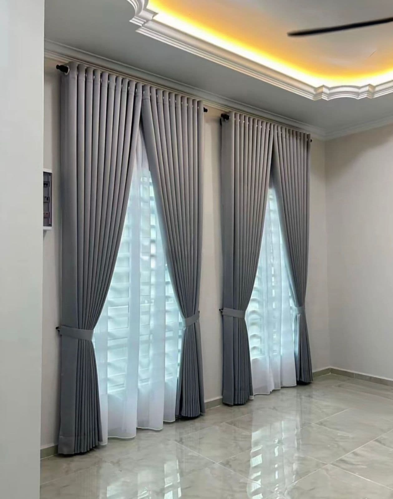 Living room with motorized floor-to-ceiling curtains